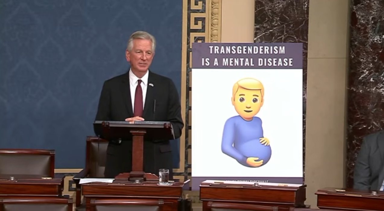Senator Tommy Tuberville with pregnant man emoji sign that says "Transgenderism is a mental disease"