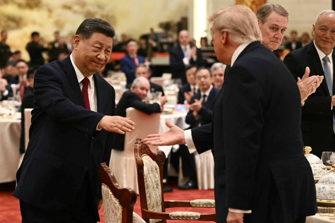 President Trump and Xi Jinping greeting each other at dinner